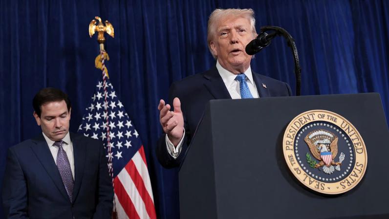 U.S. President Donald Trump speaks as Secretary of State Marco Rubio looks down during a press conference following a U.S. strike on Venezuela where President Nicolas Maduro and his wife, Cilia Flores, were captured, from Trump's Mar-a-Lago club in Palm Beach, Florida, U.S., January 3, 2026. REUTERS/Jonathan Ernst
