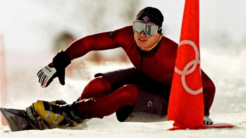 Ryan Wedding of Canada takes a practice run for the men's parallel giant slalom of the Salt Lake 2002 Winter Olympic Games in Park City, February 13, 2002. Competition in the men's parallel giant slalom begins February 14, 2002. REUTERS/Jeff J Mitchell/File Photo