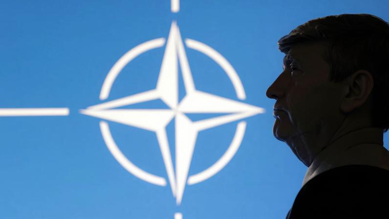 A 3D-printed miniature model of U.S. President Donald Trump with the NATO logo in the background is seen in this illustration taken April 23, 2025. REUTERS/Dado Ruvic/Illustration/File Photo