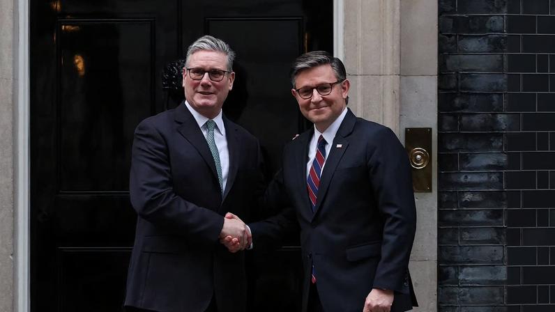 British Prime Minister Keir Starmer shakes hands with U.S. House Speaker Mike Johnson outside 10 Downing Street, in London, Britain, January 19, 2026. REUTERS/Isabel Infantes