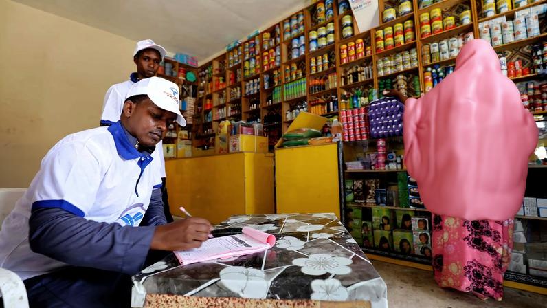 An online shop team records food orders transmitted with the World Food Program (WFP) card in Wadajir district of Mogadishu, Somalia October 26, 2020. Picture taken October 26, 2020. REUTERS/Feisal Omar