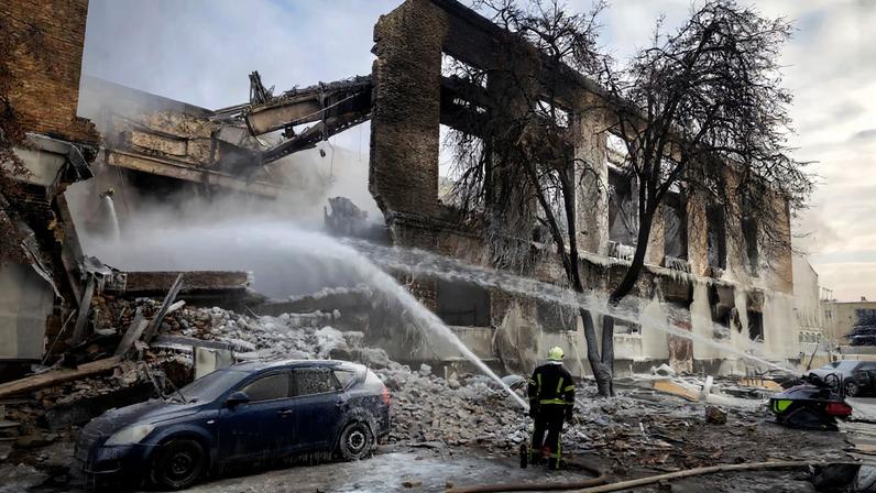 A firefighter works at the site of a building that was hit by a Russian drone, amid Russia's attack on Ukraine, in Kyiv, Ukraine January 12, 2026. REUTERS/Thomas Peter