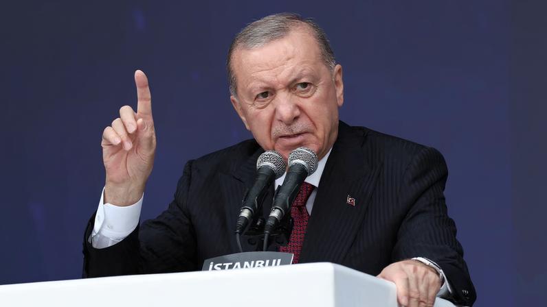 Turkish President Tayyip Erdogan speaks during a ceremony for the handover of new vehicles to the gendarmerie and police forces in Istanbul, Turkey, November 28, 2025.