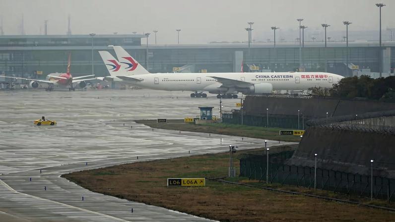 China Eastern Airlines aircrafts are parked at Pudong International Airport in Shanghai, China, March 21, 2023. REUTERS/Aly Song