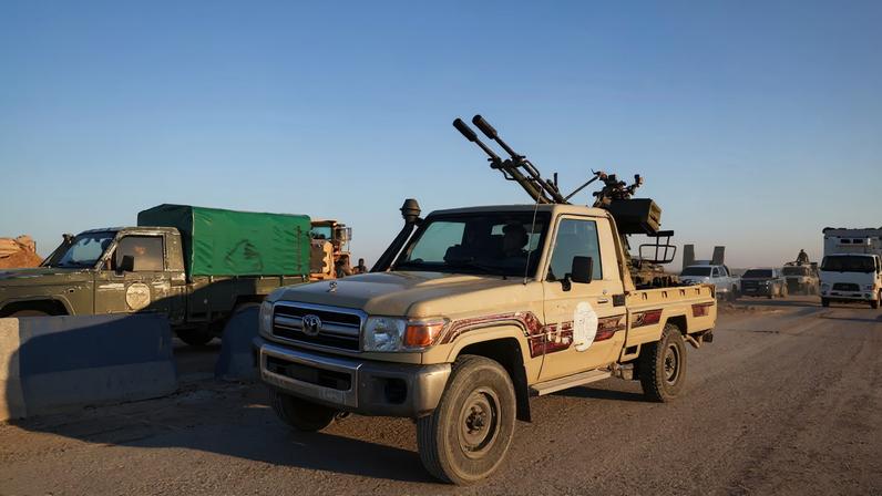 Members of the Syrian army ride a vehicle en route to Al-Hasakah, following the withdrawal of the Syrian Democratic Forces, Syria, January 20, 2026. REUTERS/Khalil Ashawi