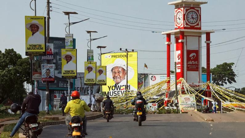 Motorcycle taxis ride towards a campaign billboard of Uganda's President and the leader of the ruling National Resistance Movement (NRM) party, Yoweri Museveni, following the general elections in Kampala, Uganda January 16, 2026. REUTERS/Thomas Mukoya