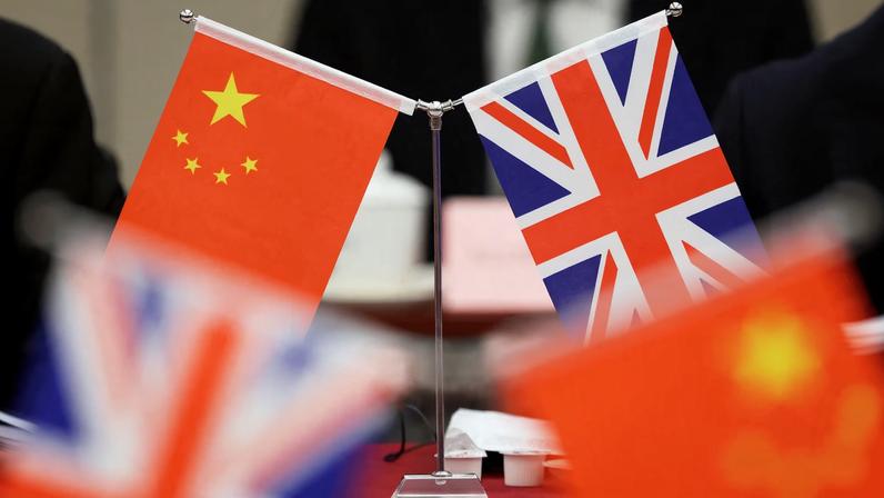 Flags of China and the Union Jack stand during the China-UK Energy Dialogue in Beijing, China March 17, 2025. REUTERS/Florence Lo/Pool