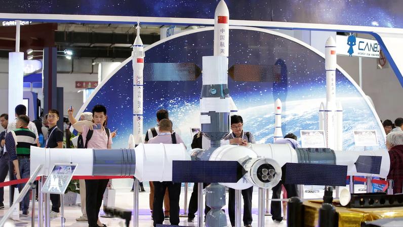 People visit the booth of China Aerospace Science and Technology Corporation at China Beijing International High-tech Expo in Beijing, China June 8, 2017. REUTERS/Jason Lee