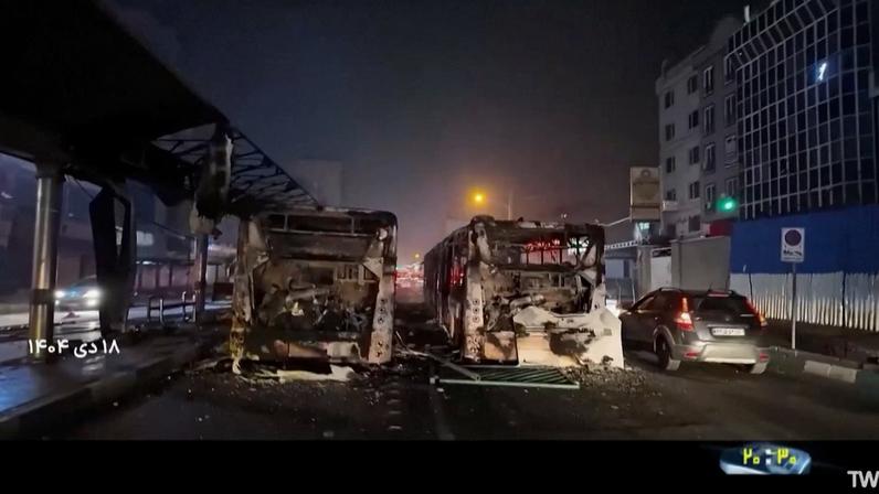 Burnt vehicles lie on the road following unrest sparked by dire economic conditions, in a place given as Tehran, Iran, January 10, 2026, in this screengrab from Iran's state media broadcast footage.