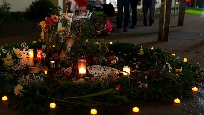 Flowers and candles are placed outside the Portland ICE facility during a vigil, after U.S. federal agents shot two people in Portland, Oregon, U.S., January 9, 2026. REUTERS/John Rudoff