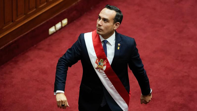 Peru's new president Jose Jeri walks on the day of the swearing-in ceremony, after Congress voted to remove former President Dina Boluarte
