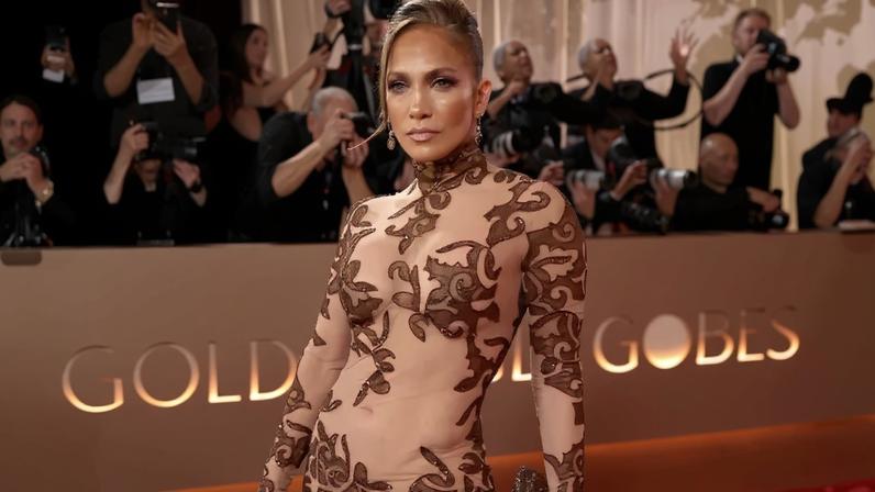 Jennifer Lopez bared her abs in vintage Jean-Louis Scherrer by Stephane Rolland at the 2026 Golden Globes.