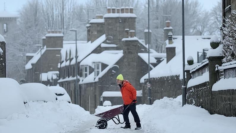 Clearing the heavy snowfall in Huntly in Aberdeenshire