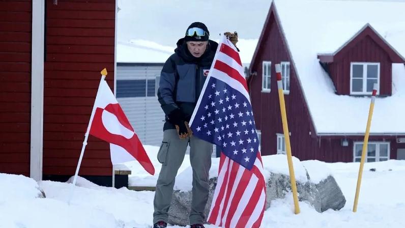 A man protests a potential U.S. annexation of Greenland in front of the U.S. Consulate in Nuuk, Greenland.