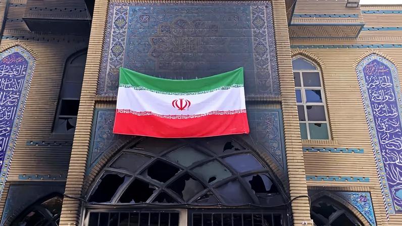 This photograph taken during a tour for foreign media shows an Iranian national flag installed on the Beheshti Mosque that was damaged during recent public protests in Tehran, Iran, on Jan. 21.