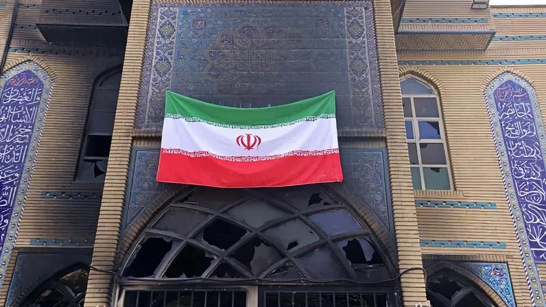 This photograph taken during a tour for foreign media shows an Iranian national flag installed on the Beheshti Mosque that was damaged during recent public protests in Tehran, Iran, on Jan. 21.