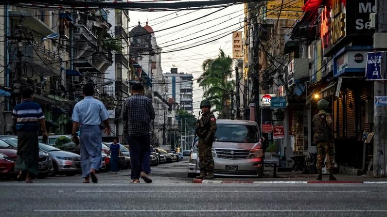 Military personnel walk the streets of Yangon, Myanmar, on Dec. 28, 2025. Sirachai Arunrugstichai/Getty Images