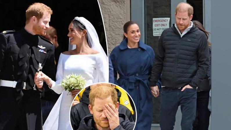 Prince Harry in a black "Invictus Games Foundation" jacket, covering his face with his hand.