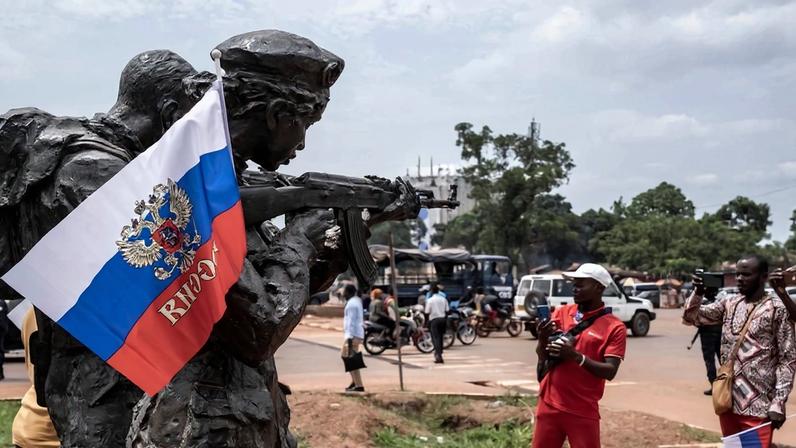 A Russian flag hangs on a monument to Russian instructors in Bangui, Central African Republic, on March 22, 2023, during a march in support of the Russian and Chinese presence there after the withdrawal of French troops.