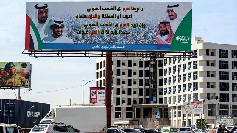 A billboard bears portraits of Saudi King Salman, Crown Prince Mohammed bin Salman, Emirati President Khalifa bin Zayed, and Abu Dhabi Crown Prince Mohamed bin Zayed in Aden, Yemen, on Nov. 6, 2019.