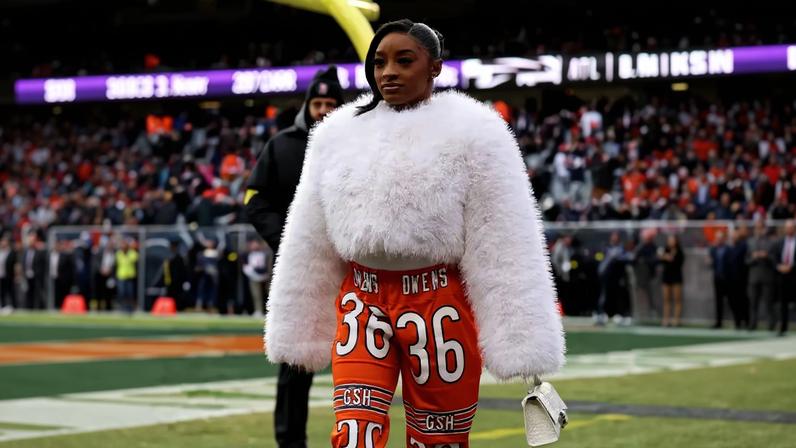 Simone Biles supported husband Jonathan Owens at the Bears vs. Lions game at Soldier Field on Sunday in custom orange pants honoring his No. 36 jersey.