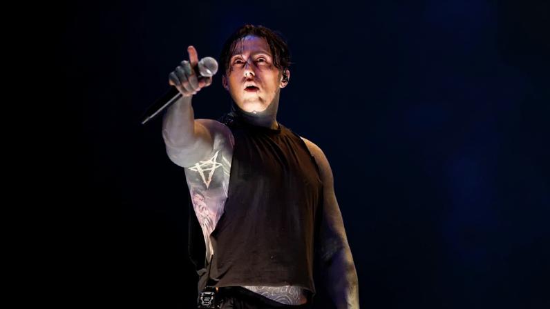 Ronnie Radke of Falling in Reverse performing onstage.