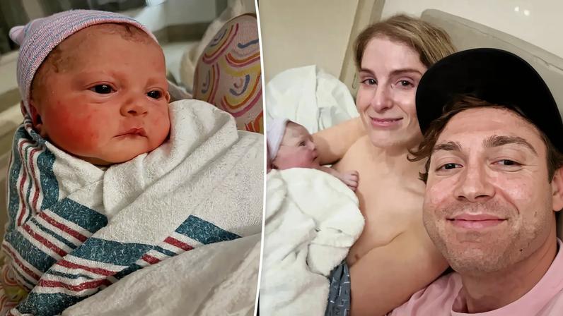 Meghan Trainor holding her newborn baby, looking tearful but happy.