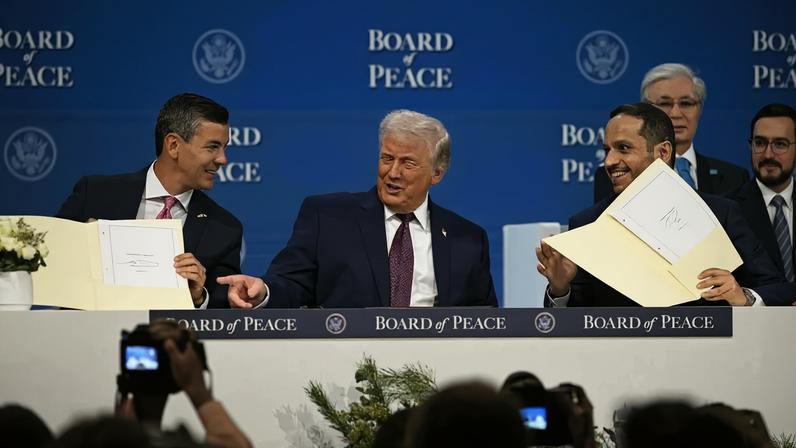 Paraguayan President Santiago Peña, U.S. President Donald Trump, and Qatari Prime Minister Sheikh Mohammed bin Abdulrahman bin Jassim Al Thani participate in the signing ceremony of the Board of Peace in Davos, Switzerland on Jan. 22.