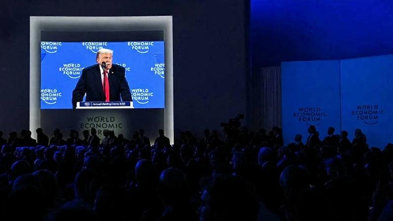 U.S. President Donald Trump is seen on a big screen as he delivers a special address during the World Economic Forum annual meeting in Davos, Switzerland, on Jan. 21.