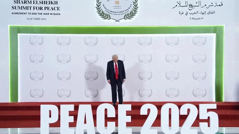 President Donald Trump waits to greet leaders during a summit to support ending the Israel-Hamas war in Sharm El Sheikh, Egypt, on Oct. 13, 2025.