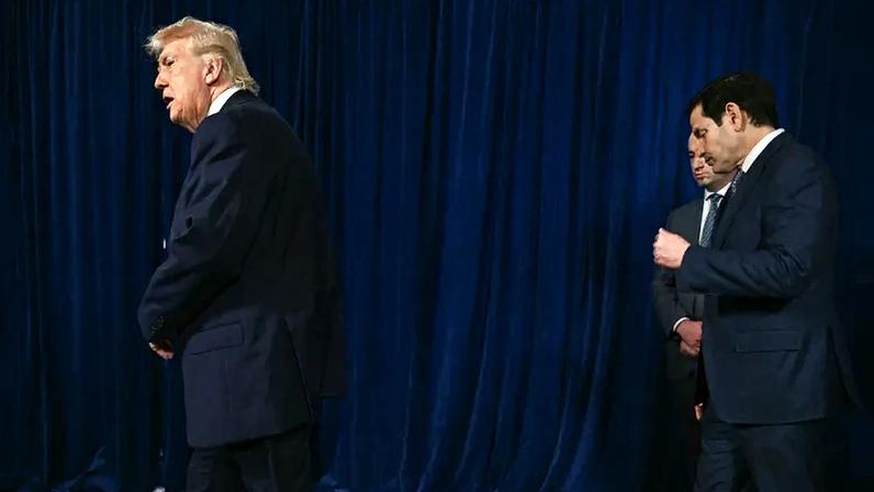 U.S. President Donald Trump, followed by deputy chief of staff Stephen Miller and Secretary of State Marco Rubio, after speaking to the press following U.S. military action in Venezuela, at his Mar-a-Lago residence in Palm Beach, Florida.