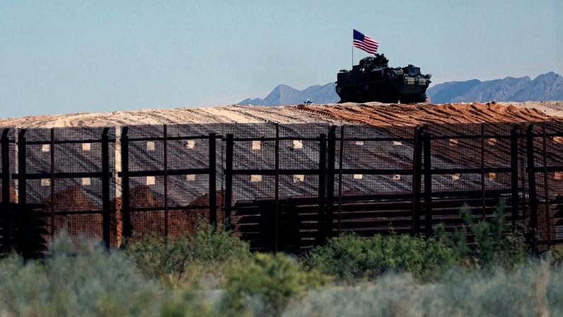 A U.S. military vehicle patrols near the border wall between Santa Teresa, New Mexico and Ciudad Juarez, Mexico on August 28, 2025.