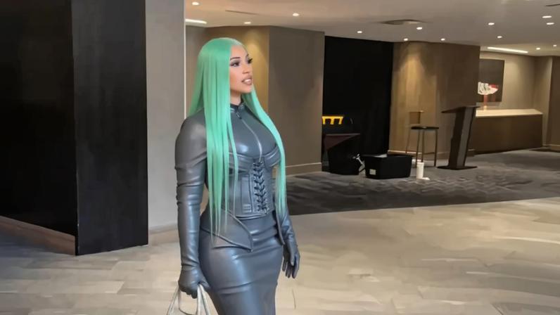 Cardi B faced the frigid Colorado temperatures in an all-leather look to support boyfriend Stefon Diggs and the New England Patriots.