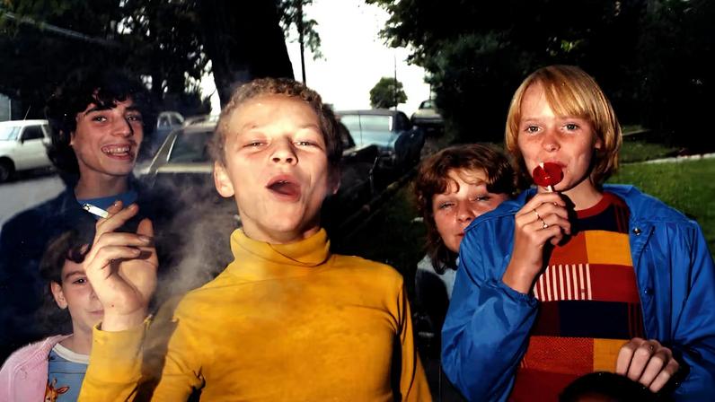 In your face: Boy in Yellow Shirt Smoking (1976) is a typical image by Cohen that is “simultaneously haunting and brimming with life”