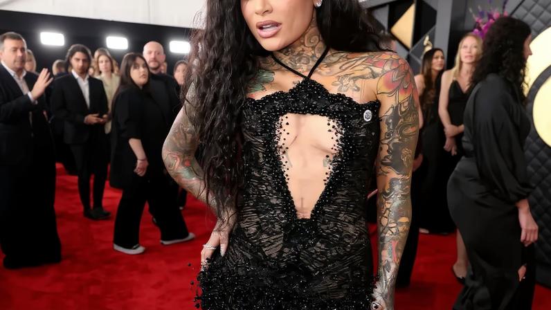 Kehlani in a black beaded gown with a plunging neckline on the red carpet at the 68th GRAMMY Awards.