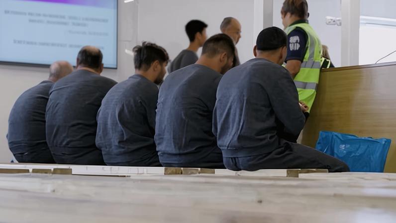 Small-boat migrants and asylum seekers being processed by Border Force officers last year under the ‘one in, one out’ scheme.