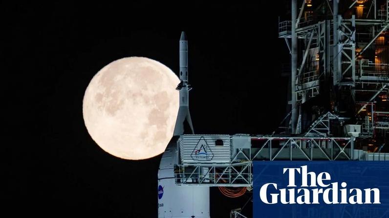 A full moon shines over Nasa’s SLS and Orion spacecraft at Kennedy Space Center in Florida.