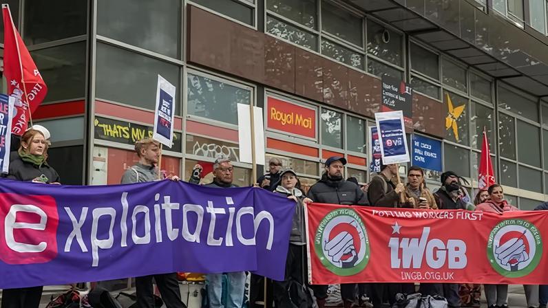 eCourier strikers and union representatives protest outside a Royal Mail delivery office in Whitechapel, east London, in November 2024.
