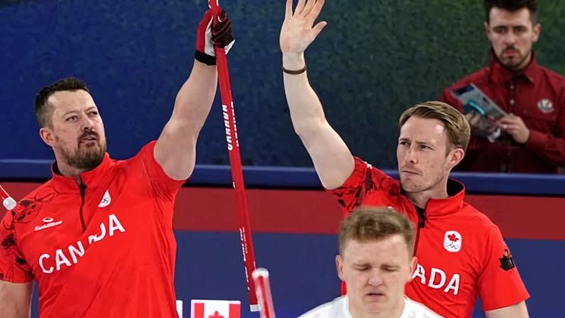 Canada's Ben Hebert and Marc Kennedy acknowledge the crowd after beating Great Britain.