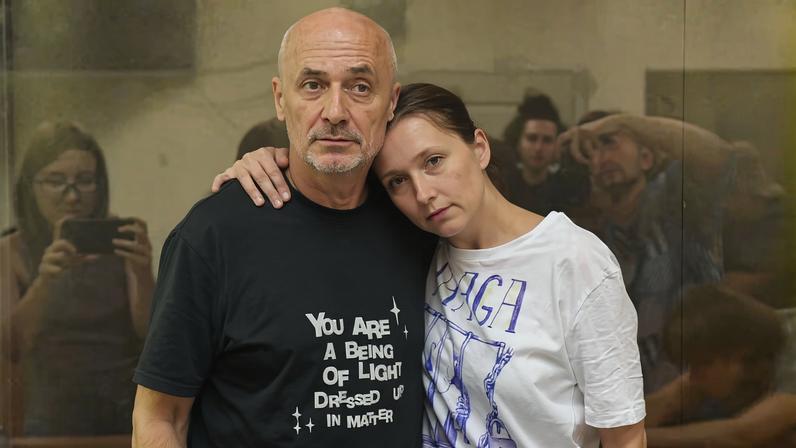 Aleksandr Dotsenko (left) with his wife Anastasia Dyudyaeva in the courtroom dock