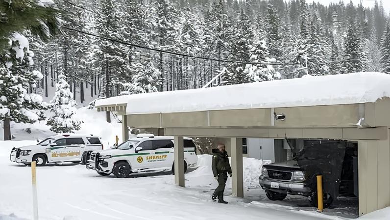 A Nevada county sheriff's deputy walks outside the Truckee substation, on Thursday.