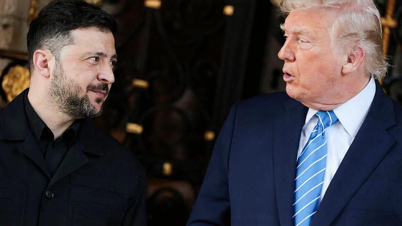 Ukrainian President Volodymyr Zelenskiy looks at U.S. President Donald Trump upon his arrival for meetings at Trump's Mar-a-Lago club in Palm Beach, Florida, U.S., December 28, 2025. REUTERS/Jonathan Ernst
