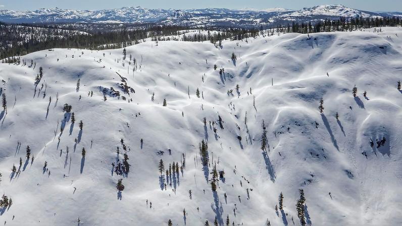 FILE PHOTO: The snow-covered Sierra Nevada Mountains are seen from the air during a Pacific Gas and Electric snowpack survey near Nevada City, California, U.S. April 3, 2017. REUTERS/Bob Strong/File Photo