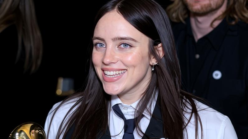 Billie Eilish wears an ‘ICE out’ badge on her lapel at the Grammy awards in Los Angeles.