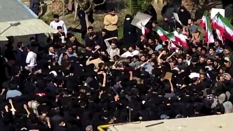 A video grab taken from social media and verified by AFP shows students clashing with security forces at Amirkabir University of Technology in Tehran.