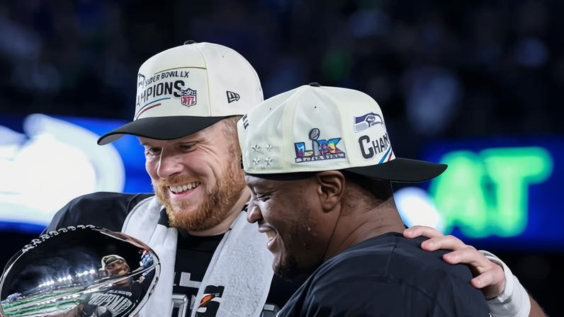 Sam Darnold and Kenneth Walker III celebrate their Super Bowl victory.