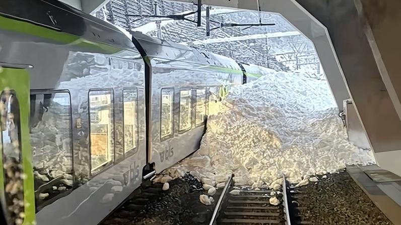 Photograph released by regional police showing the train derailed due to an avalanche in Goppenstein, southern Switzerland.