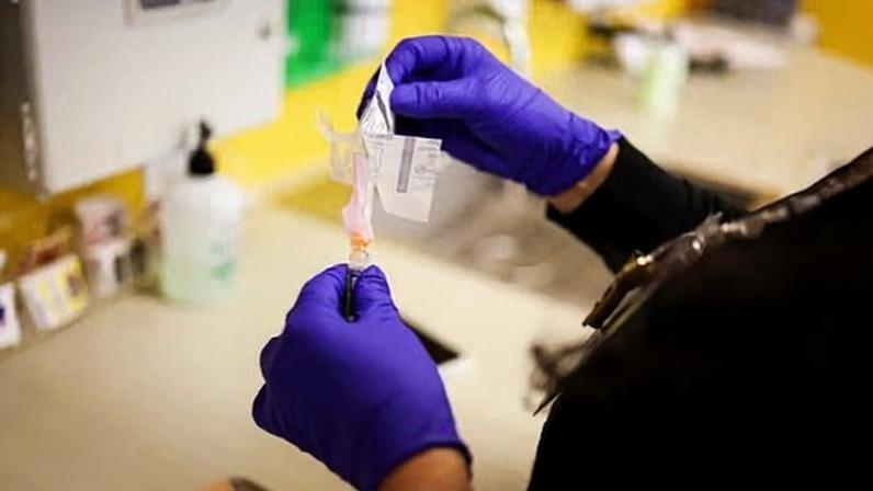 A medical assistant prepares a flu vaccine to be administered at a clinic in Chicago, Illinois, on 31 December 2025.