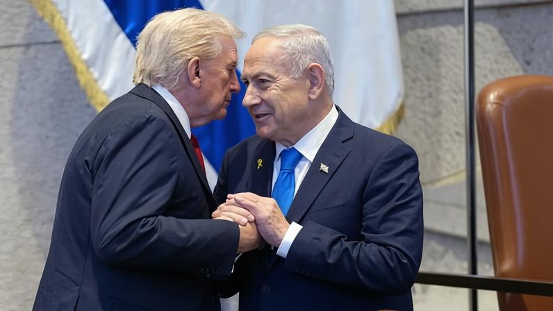 Donald Trump, left, talks with Benjamin Netanyahu at the Knesset in October 2025