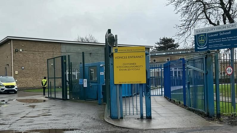 Police outside Kingsbury high school, north-west London, where two boys, aged 12 and 13, were stabbed on Tuesday.